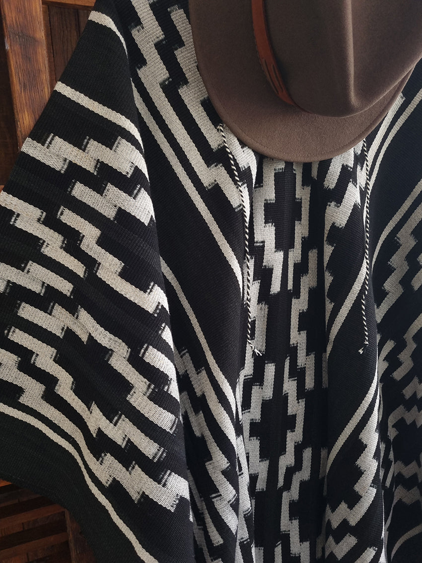 Close-up of Quijano Pampa wool poncho with white cross motif