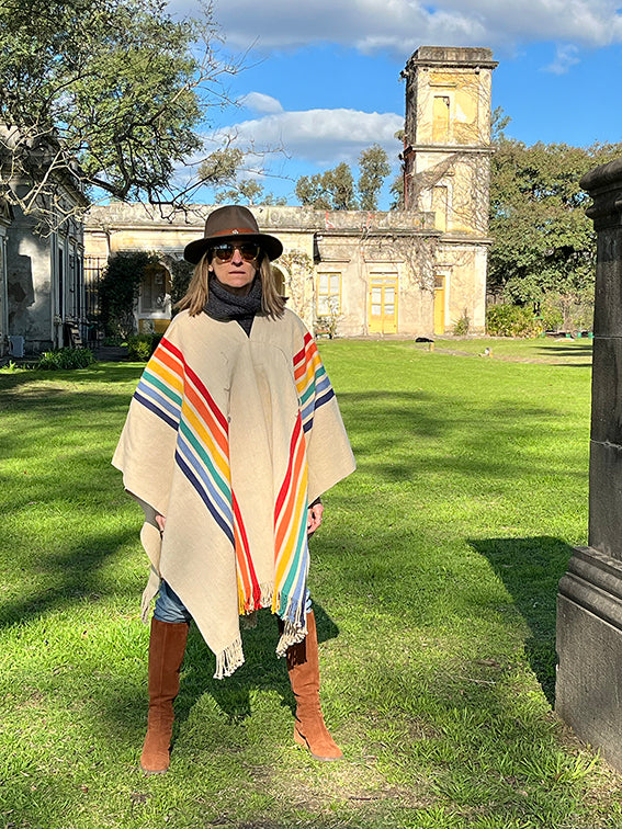 Handcrafted Argentine poncho with rainbow stripe design by Vakiano