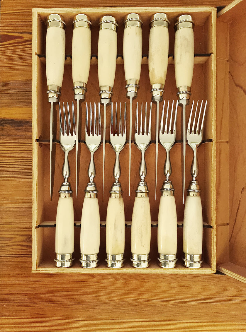 White bone handle steak knives and forks