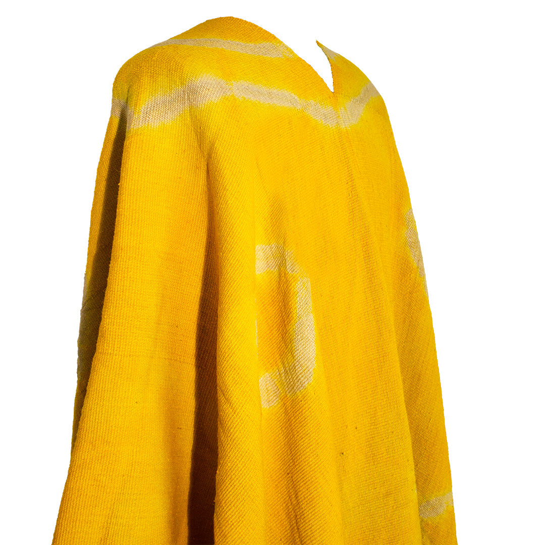 Close-up of Anzulón Argollas poncho with circular tie-dye wool motifs